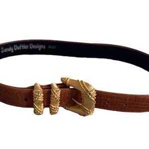 Vintage brown leather belt with heavy gold tone buckle.